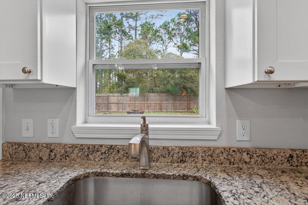 932 Puryear Street St. Augustine, FL 32084 - Photo 10 of 29 a view of a window and a white sink