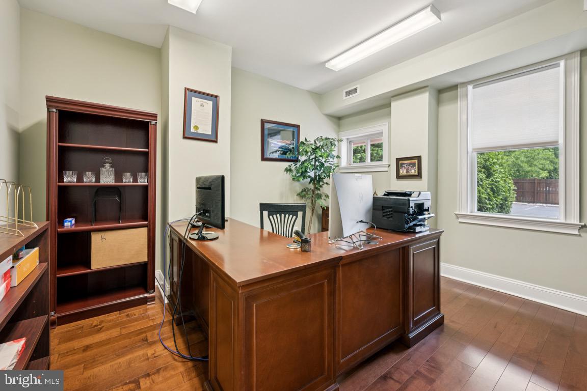 1526 Haddonfield-Berlin Road Cherry Hill, NJ 08003 - Photo 12 of 24 a room with kitchen island a sink a counter top space and living room view