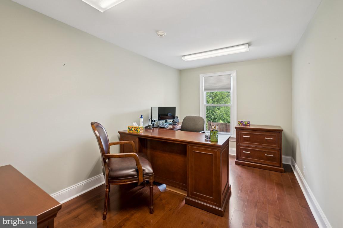 1526 Haddonfield-Berlin Road Cherry Hill, NJ 08003 - Photo 19 of 24 a view of a workspace with furniture and a window