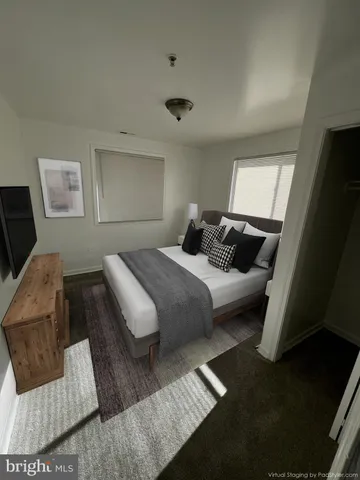 a bedroom with a bed and a couch