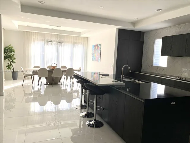 a view of a kitchen and dining room