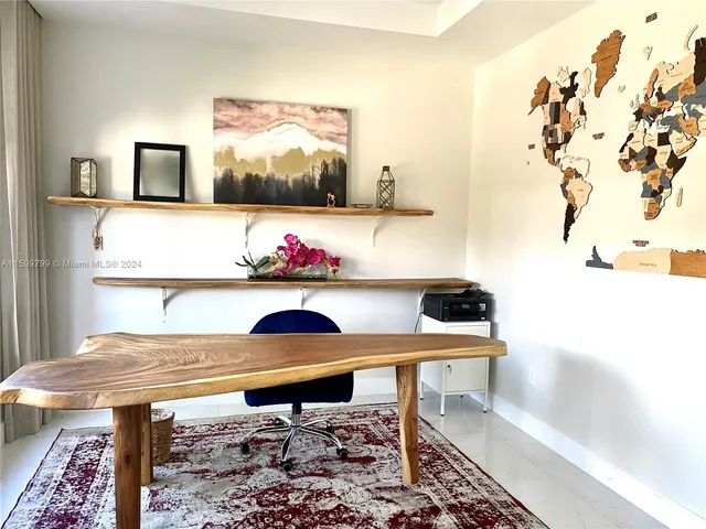 a view of a workspace with furniture