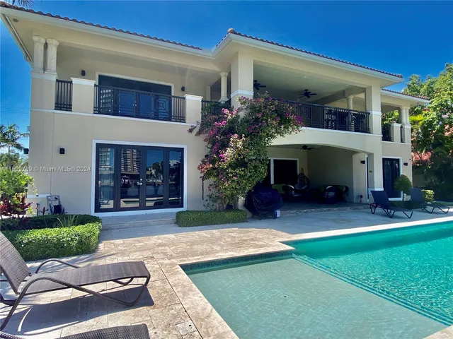 a view of a house with a yard and a fireplace