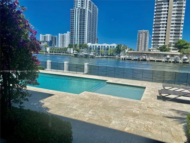 a view of a swimming pool with a lake