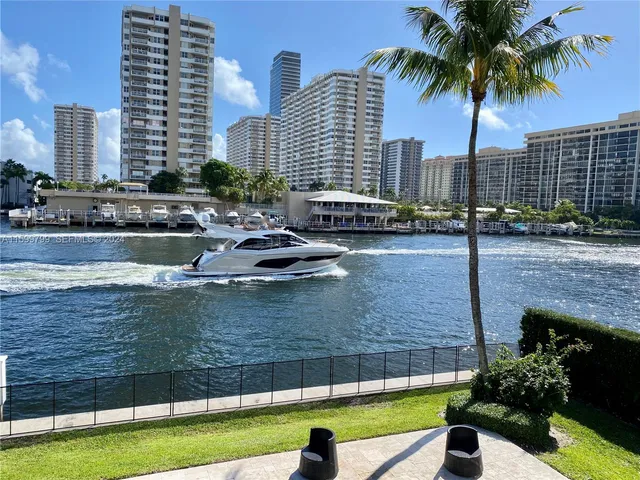 a swimming pool with outdoor seating and yard