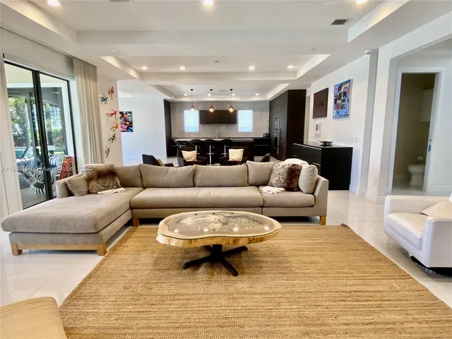 a living room with furniture and a rug