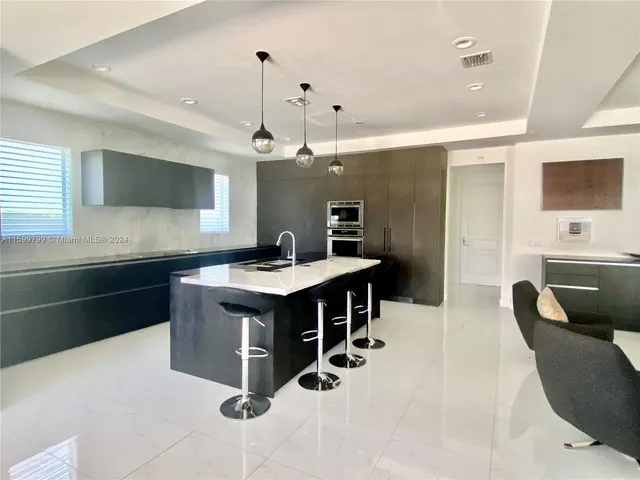 a kitchen with counter top space and furniture