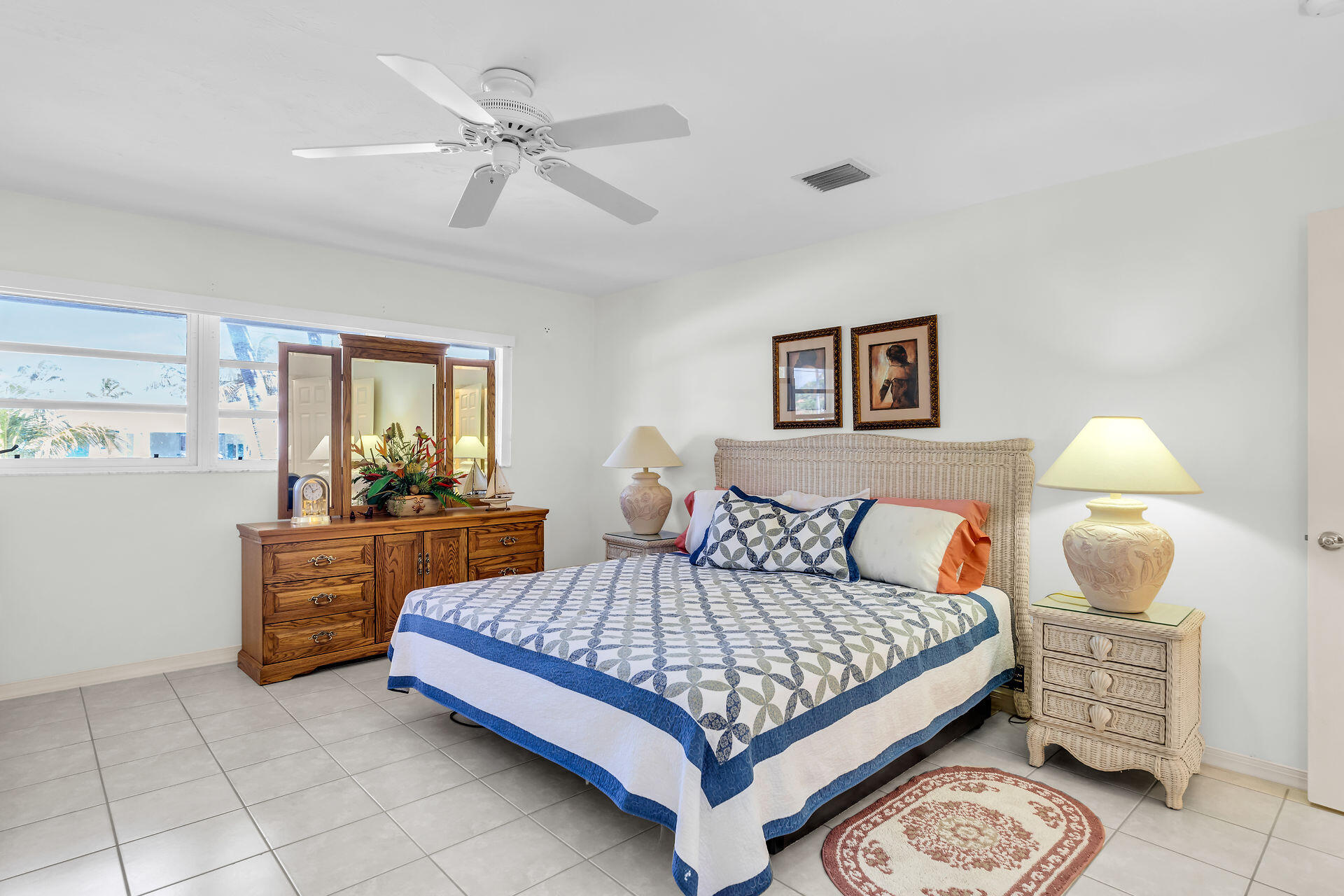 130 9th Street Key Colony Beach, FL 33051 - Photo 15 of 36 a bedroom with a bed and dresser