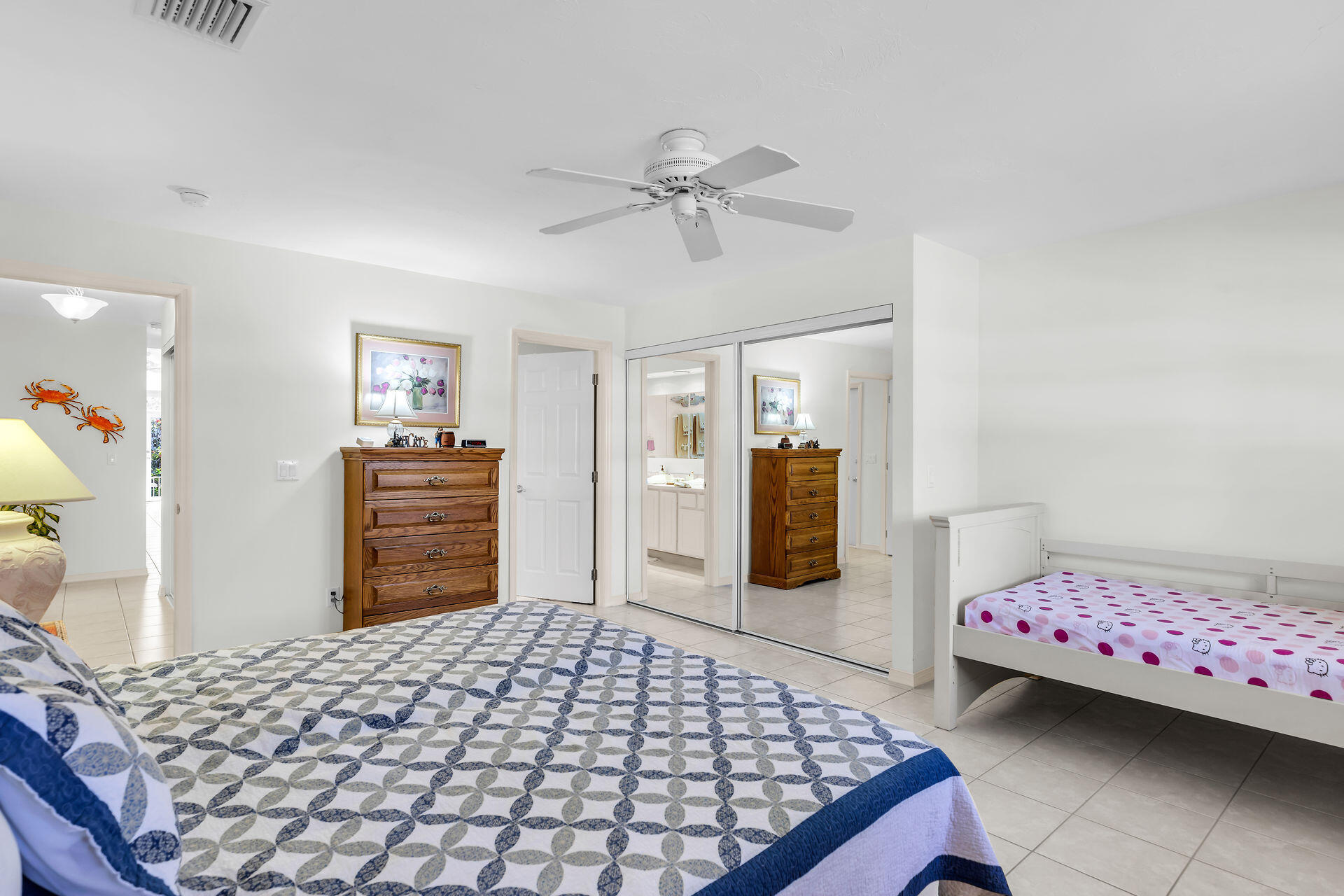 130 9th Street Key Colony Beach, FL 33051 - Photo 17 of 36 a bedroom with a bed and dresser