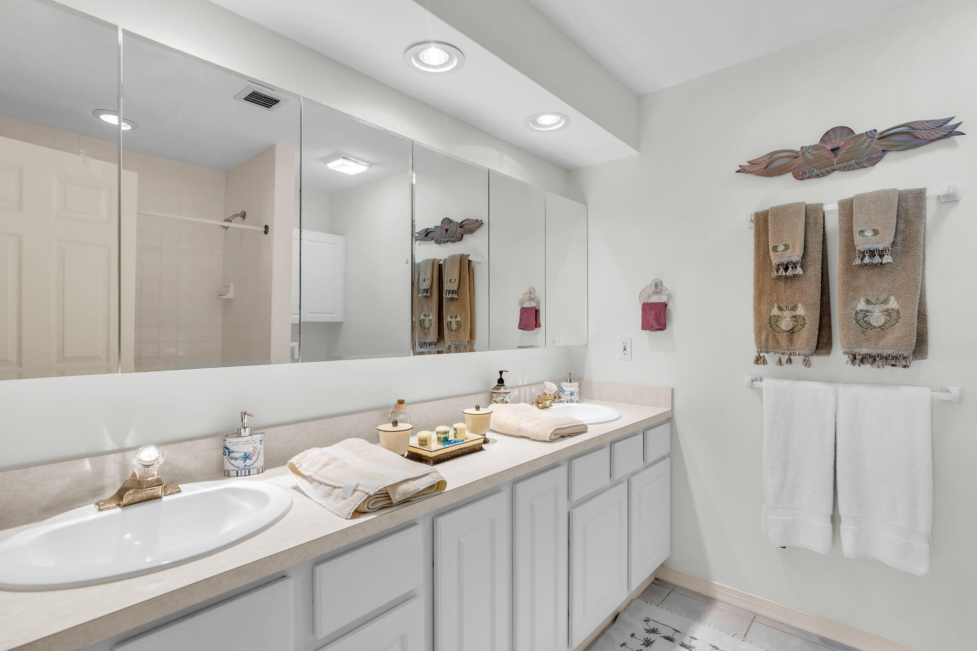 130 9th Street Key Colony Beach, FL 33051 - Photo 18 of 36 a bathroom with a double vanity sink and a mirror