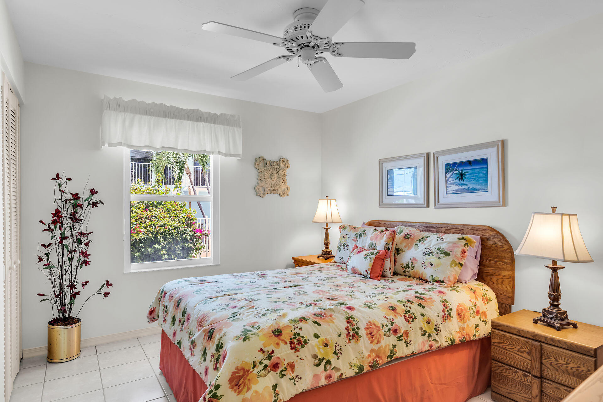 130 9th Street Key Colony Beach, FL 33051 - Photo 20 of 36 a bedroom with a large bed and a chandelier