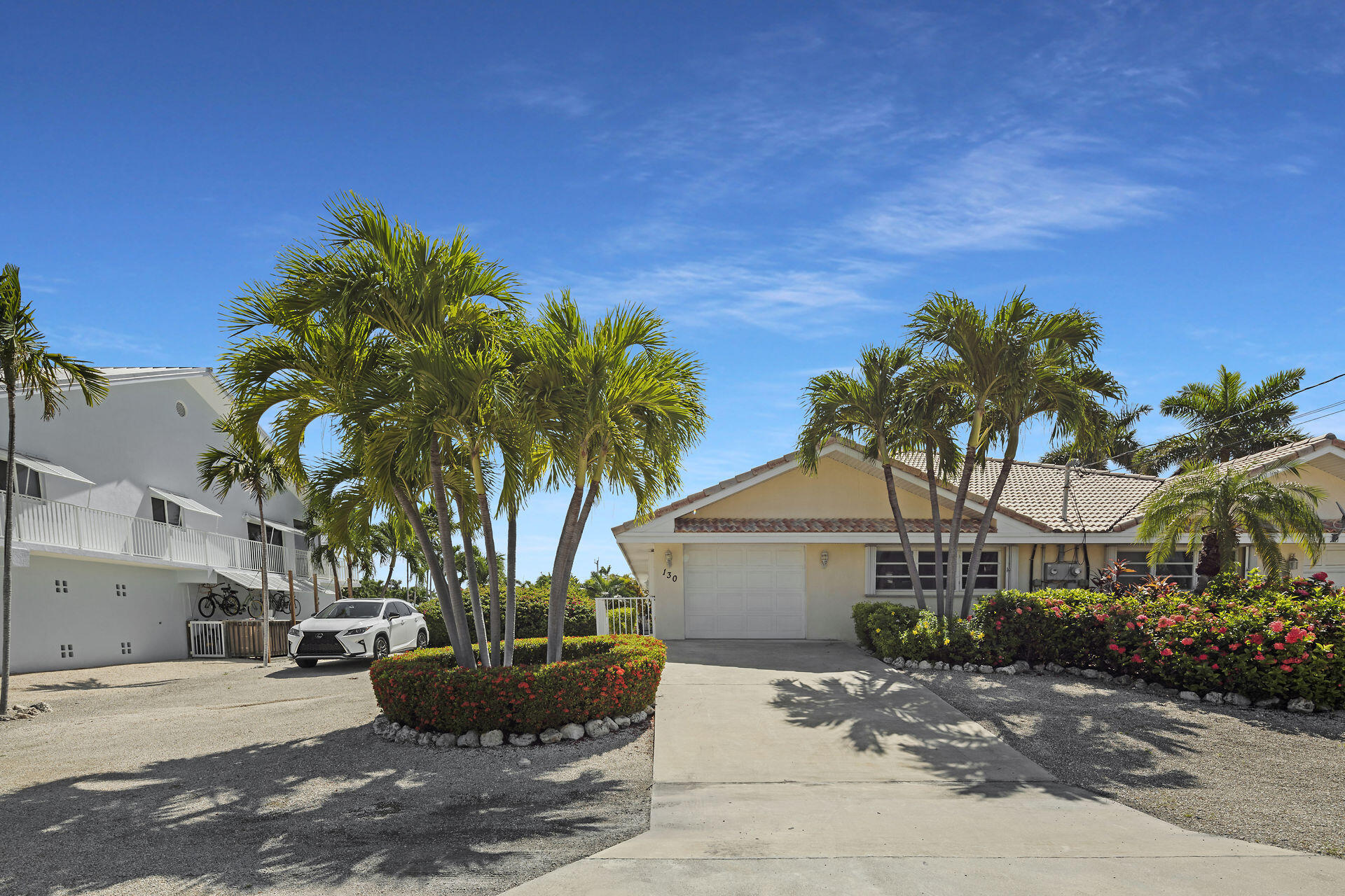 130 9th Street Key Colony Beach, FL 33051 - Photo 2 of 36 a view of a house with a garden