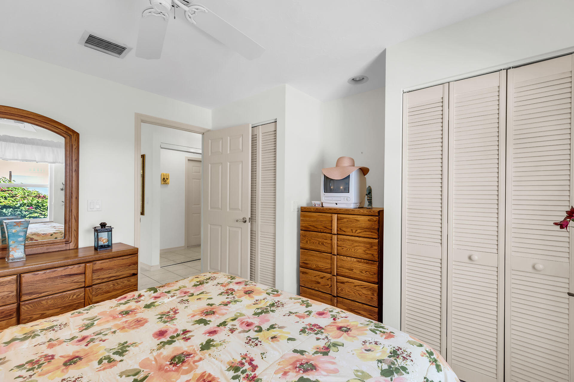 130 9th Street Key Colony Beach, FL 33051 - Photo 22 of 36 a bedroom with a bed and a dresser