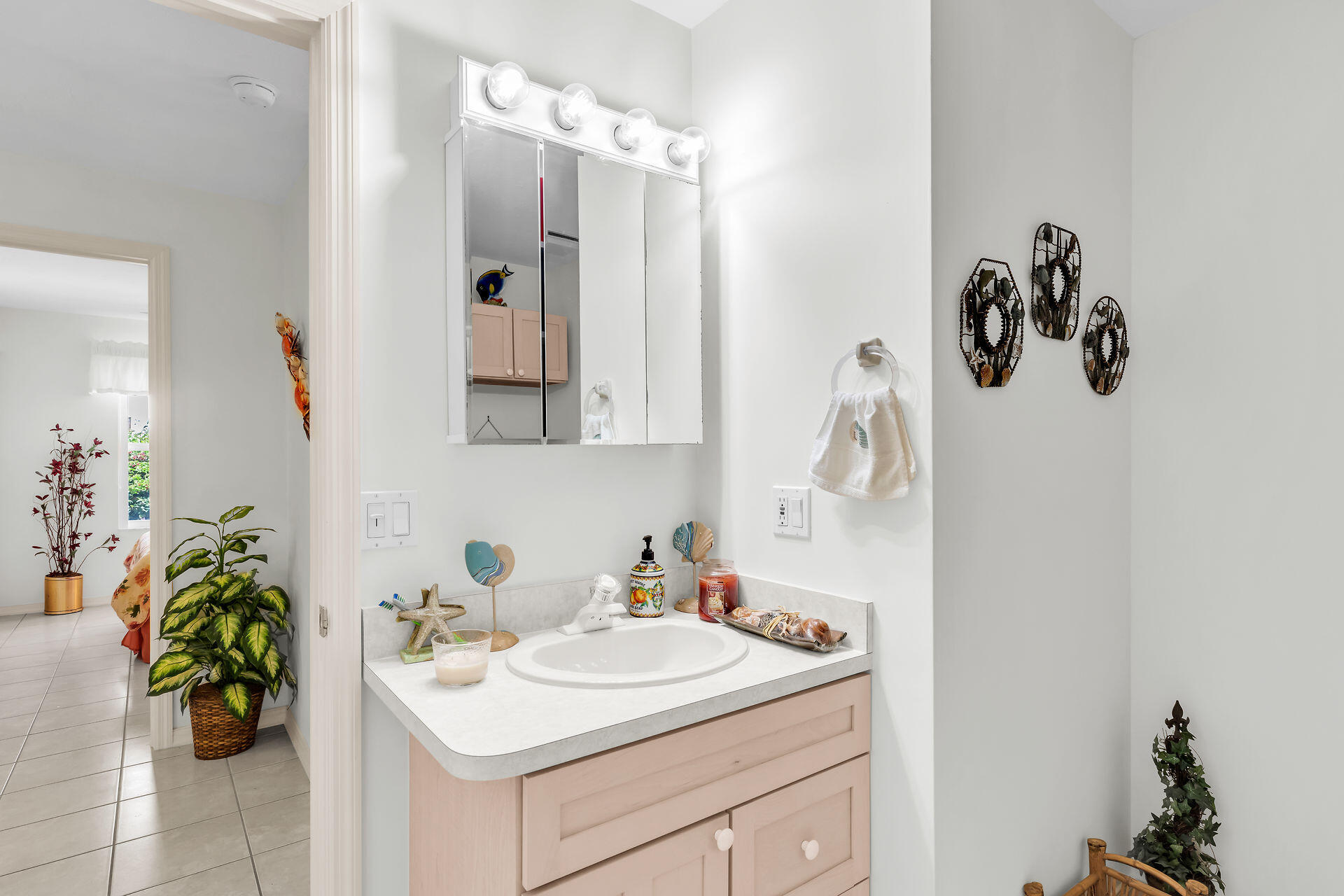 130 9th Street Key Colony Beach, FL 33051 - Photo 24 of 36 a bathroom with a sink and mirror with shower