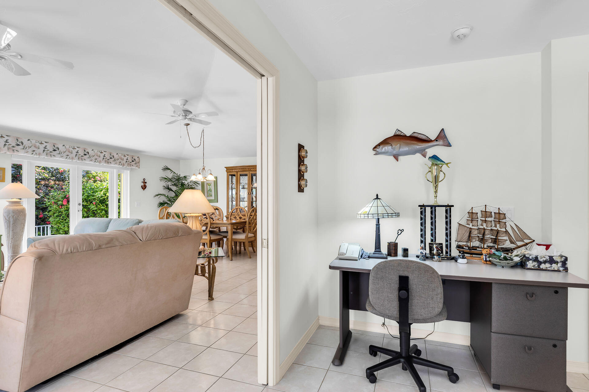 130 9th Street Key Colony Beach, FL 33051 - Photo 26 of 36 a living room with furniture and a chandelier