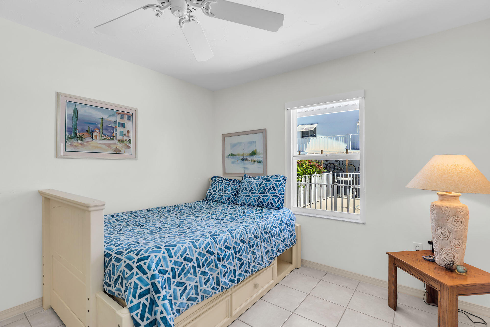 130 9th Street Key Colony Beach, FL 33051 - Photo 27 of 36 a bedroom with a bed and a table in it