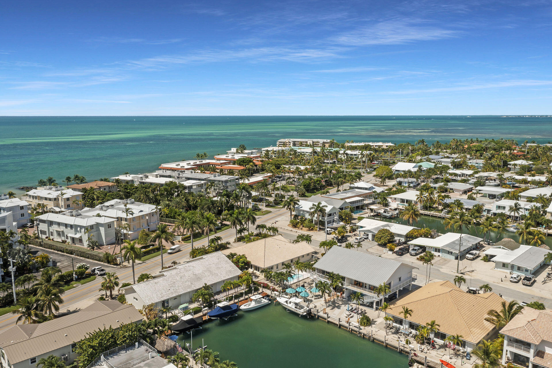 130 9th Street Key Colony Beach, FL 33051 - Photo 32 of 36 an aerial view of a city with ocean view in back