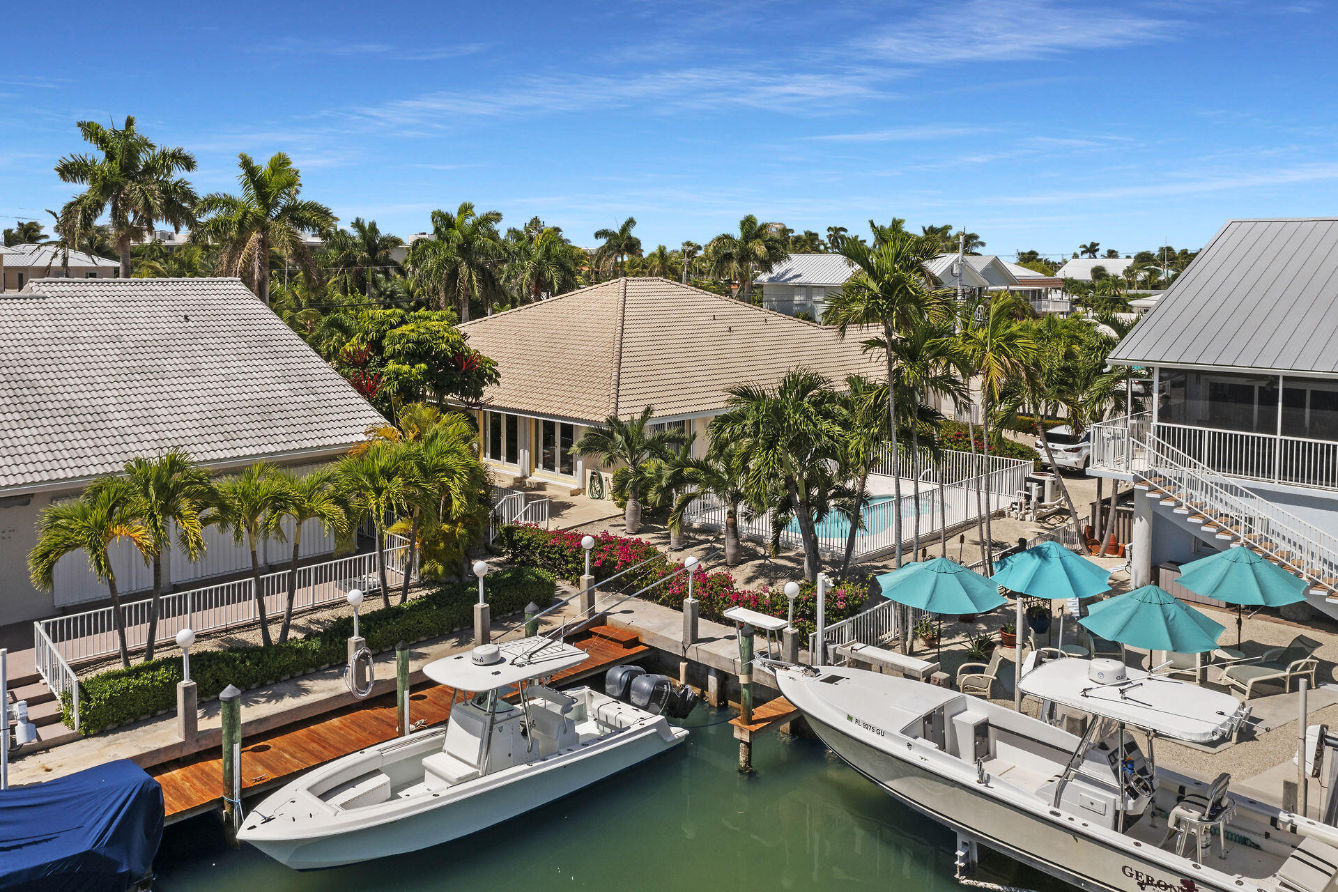 130 9th Street Key Colony Beach, FL 33051 - Photo 33 of 36 an aerial view of a house with a garden and lake view