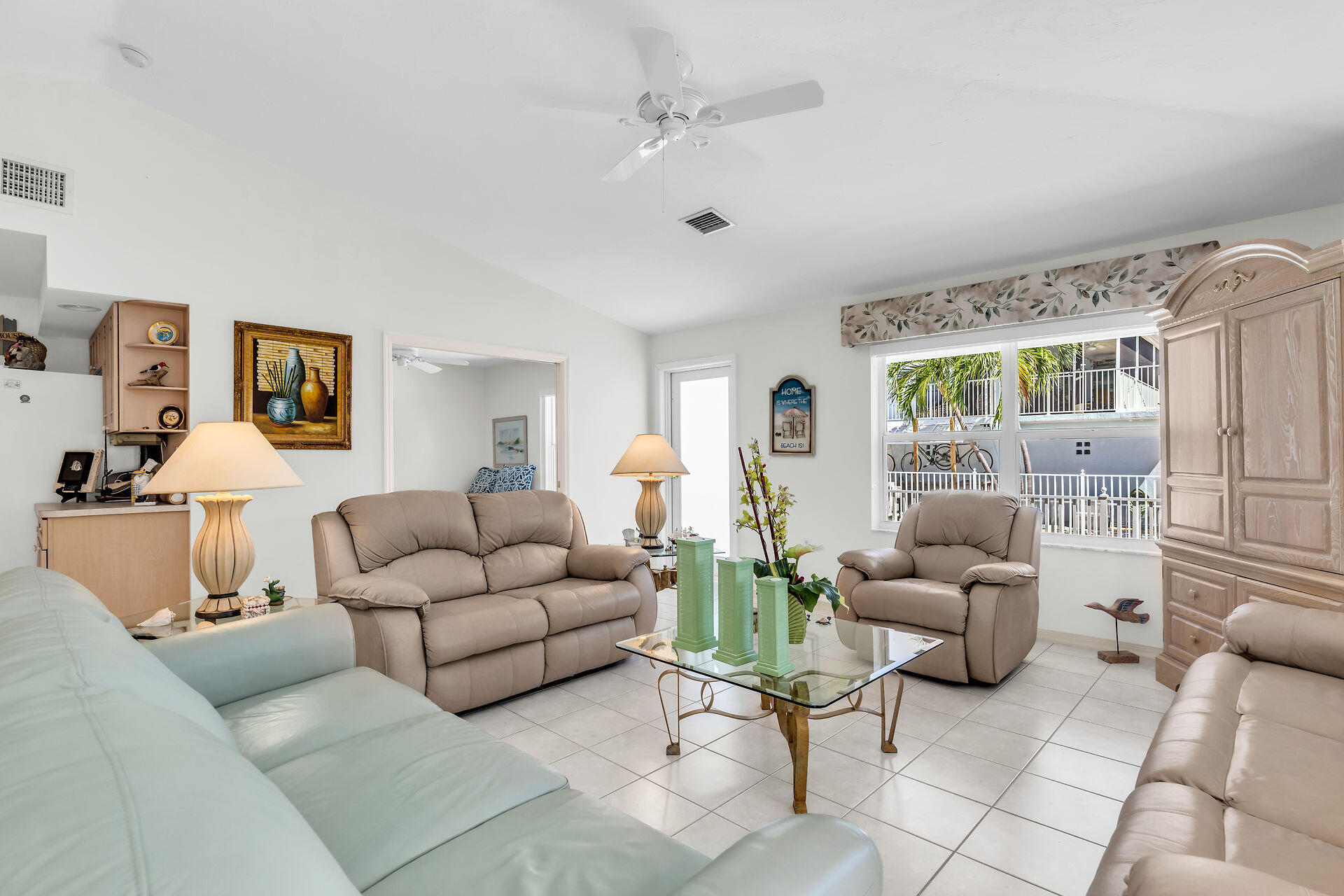 130 9th Street Key Colony Beach, FL 33051 - Photo 6 of 36 a living room with furniture and a large window