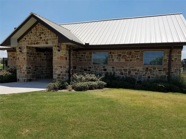 a view of a house with backyard and porch