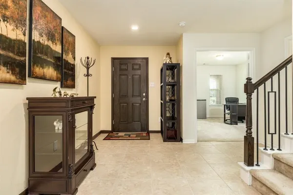a view of a hallway with living room