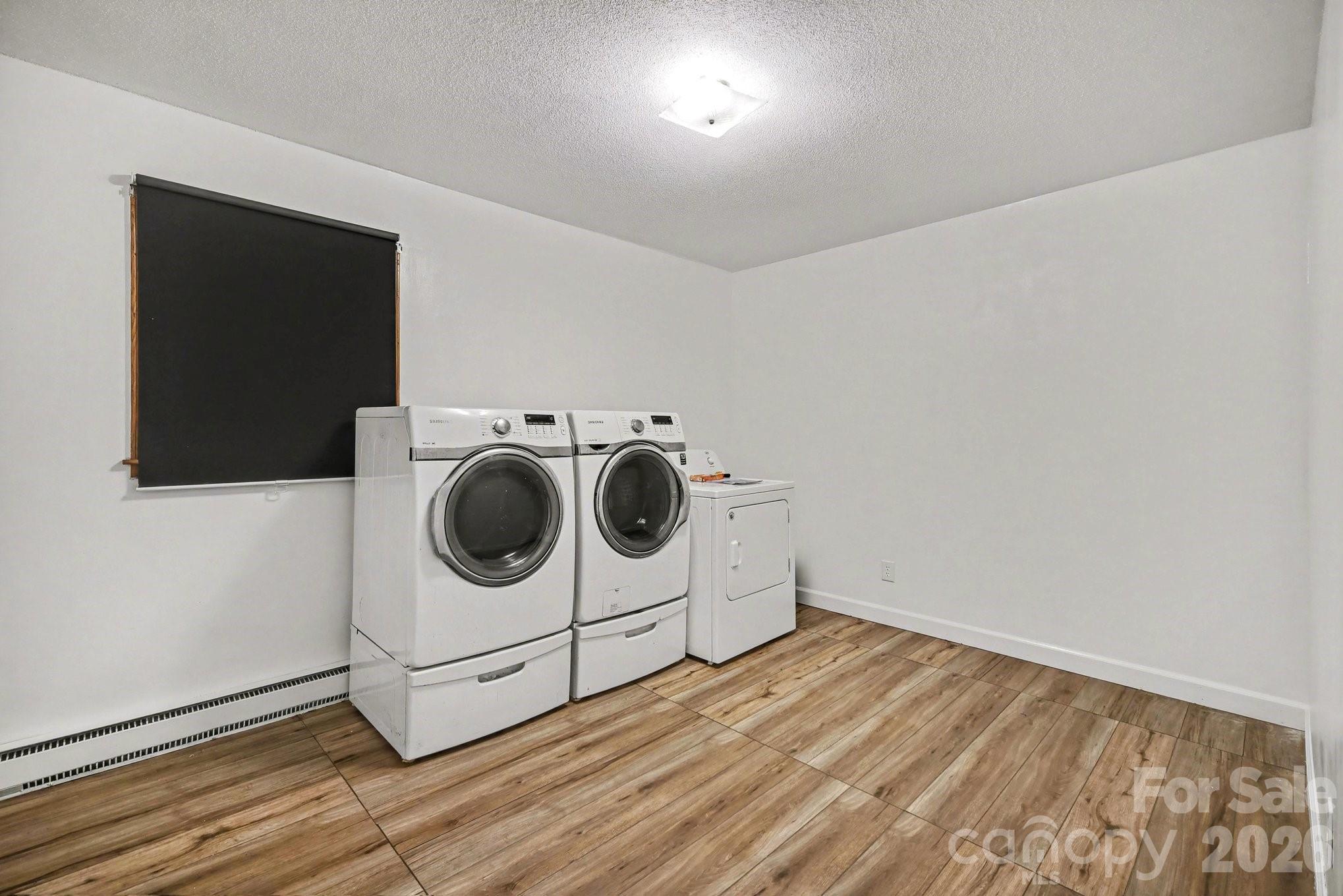 1145 Craigbrow Circle Chester, SC 29706 - Photo 16 of 27 a utility room with wooden floor washer and dryer