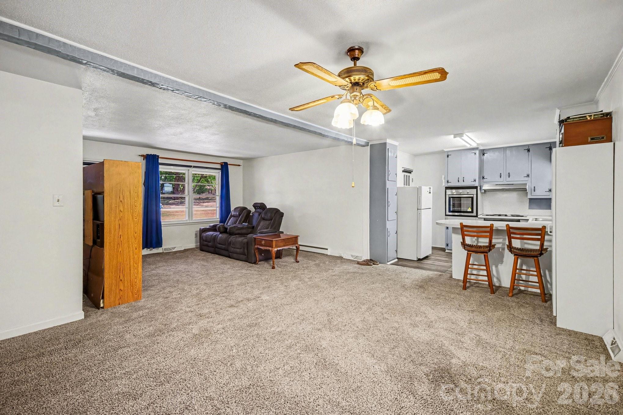 1145 Craigbrow Circle Chester, SC 29706 - Photo 7 of 27 a view of a livingroom with furniture and a ceiling fan
