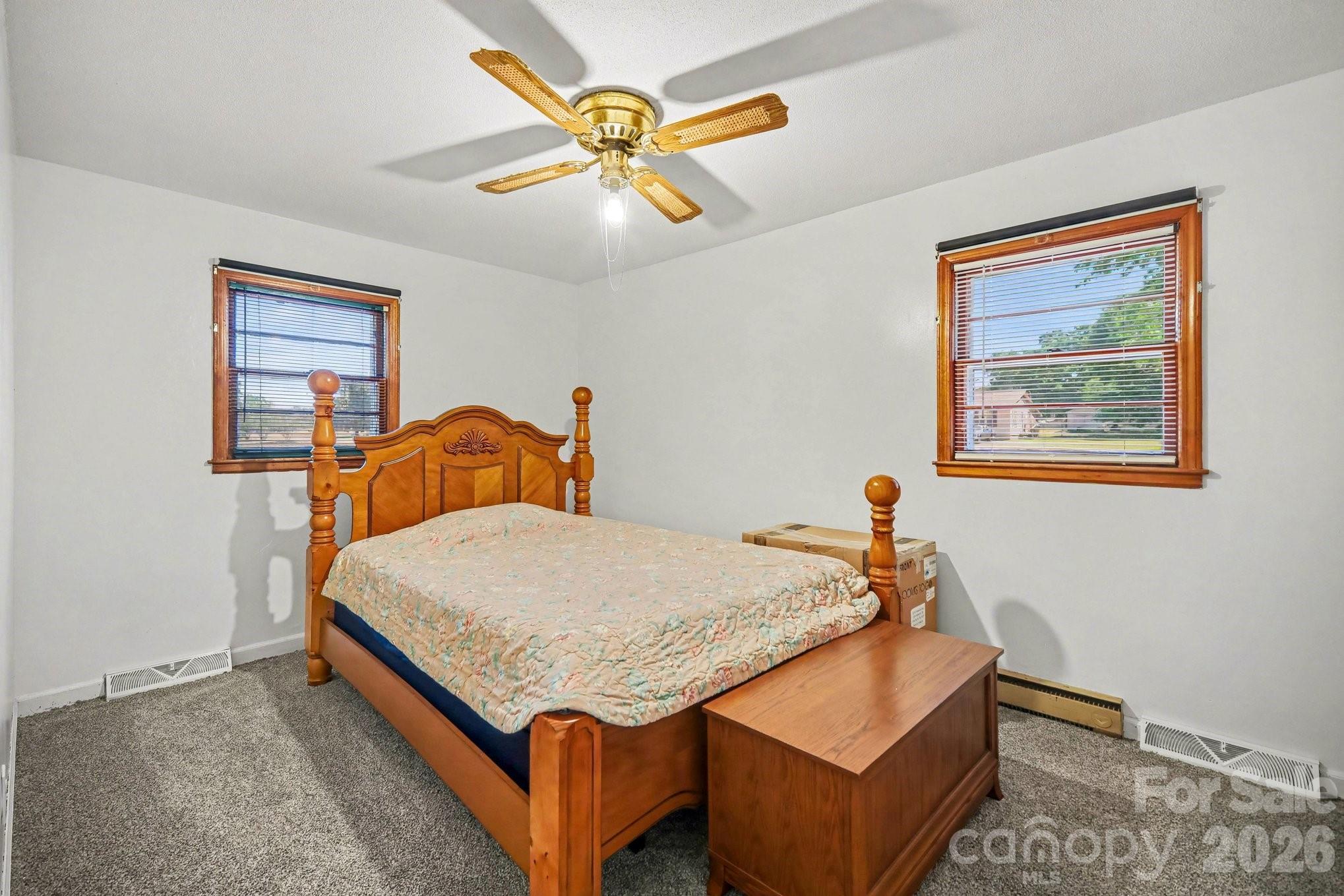 1145 Craigbrow Circle Chester, SC 29706 - Photo 10 of 27 a bedroom with a bed and a chandelier