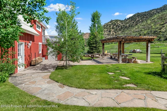 a view of a backyard with a patio