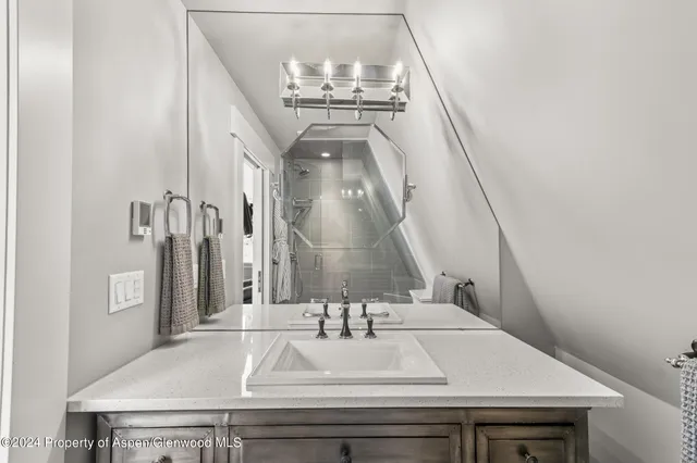 a view of hall way with mirror