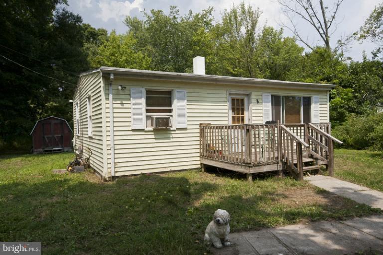 2842 Lodge Farm Road Sparrows Point, MD 21219 - Photo 3 of 8 a view of a house with a yard and deck