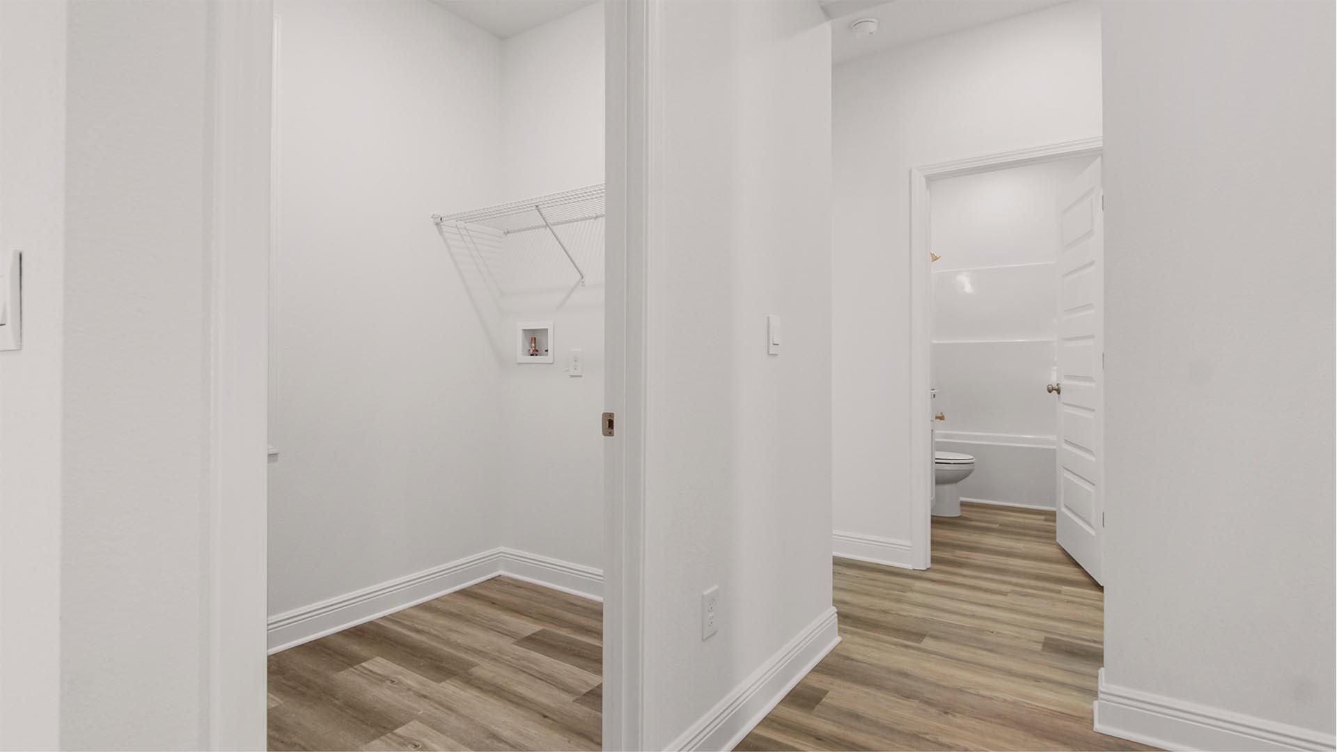 16 Foxtrail Run Freeport, FL 32439 - Photo 14 of 17 a view of a hallway with wooden floor and closet