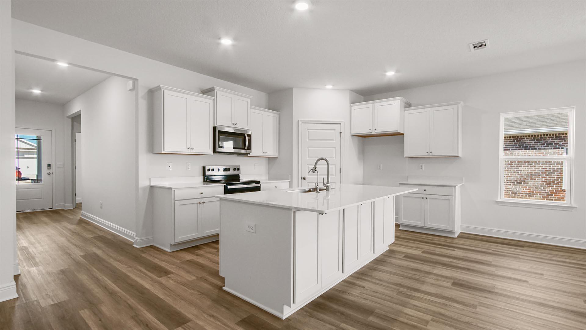 16 Foxtrail Run Freeport, FL 32439 - Photo 5 of 17 a kitchen with white cabinets and appliances