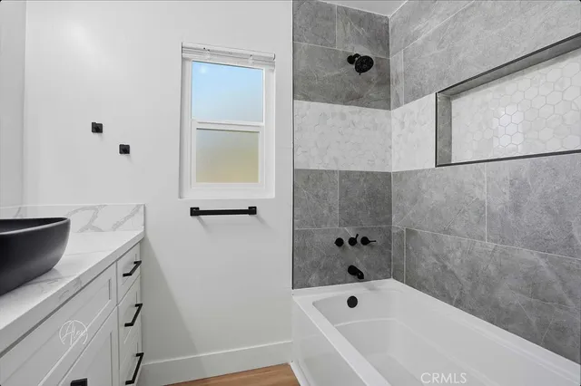 a bathroom with a bathtub and a shower