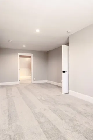 an empty room with window and pillar in it