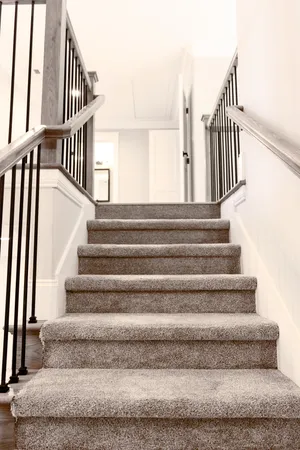 a view of staircase with white walls