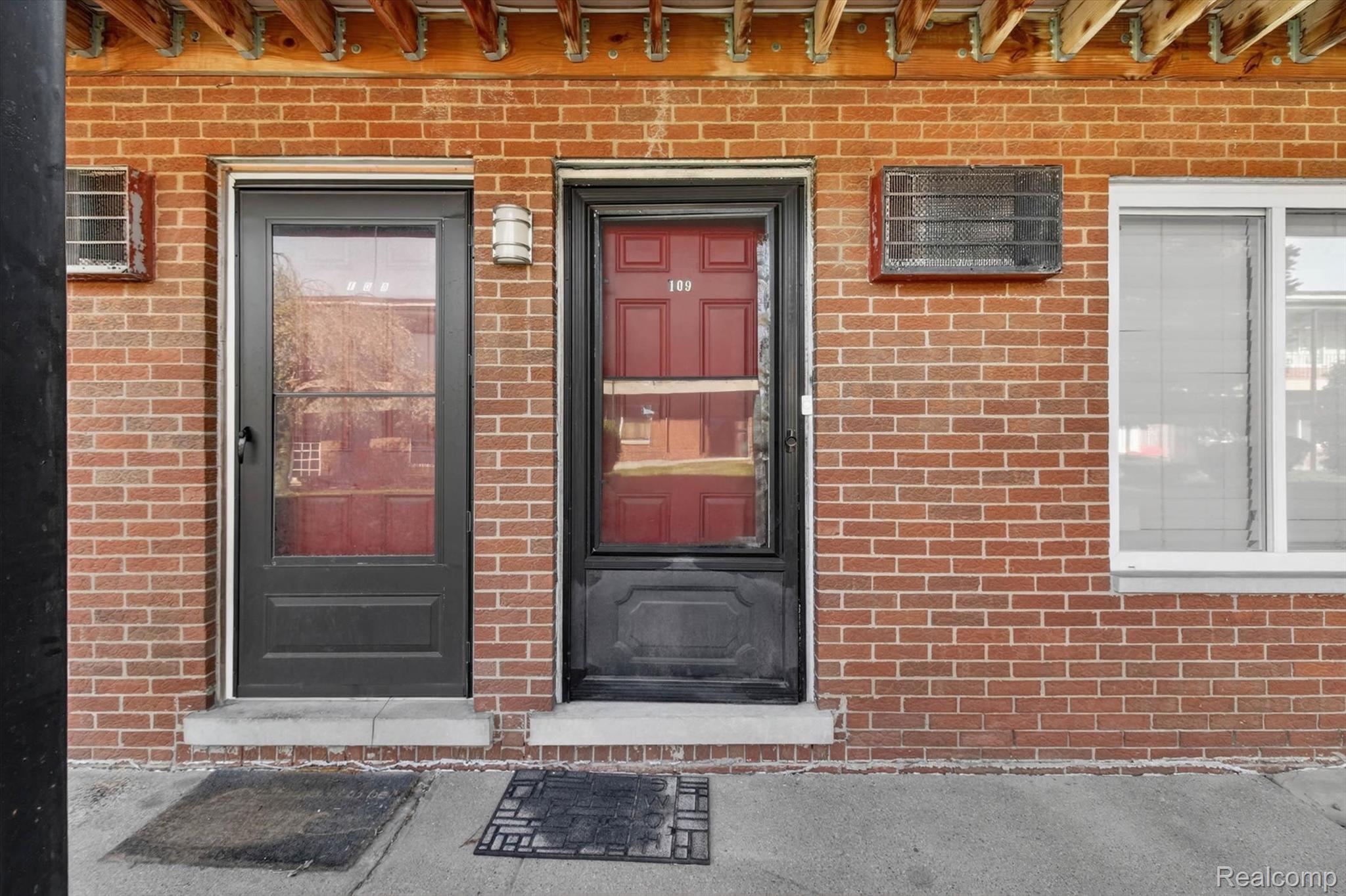 25301 Five Mile Road, Unit 109 Redford, MI 48239 - Photo 5 of 22 Doorway to property featuring brick siding