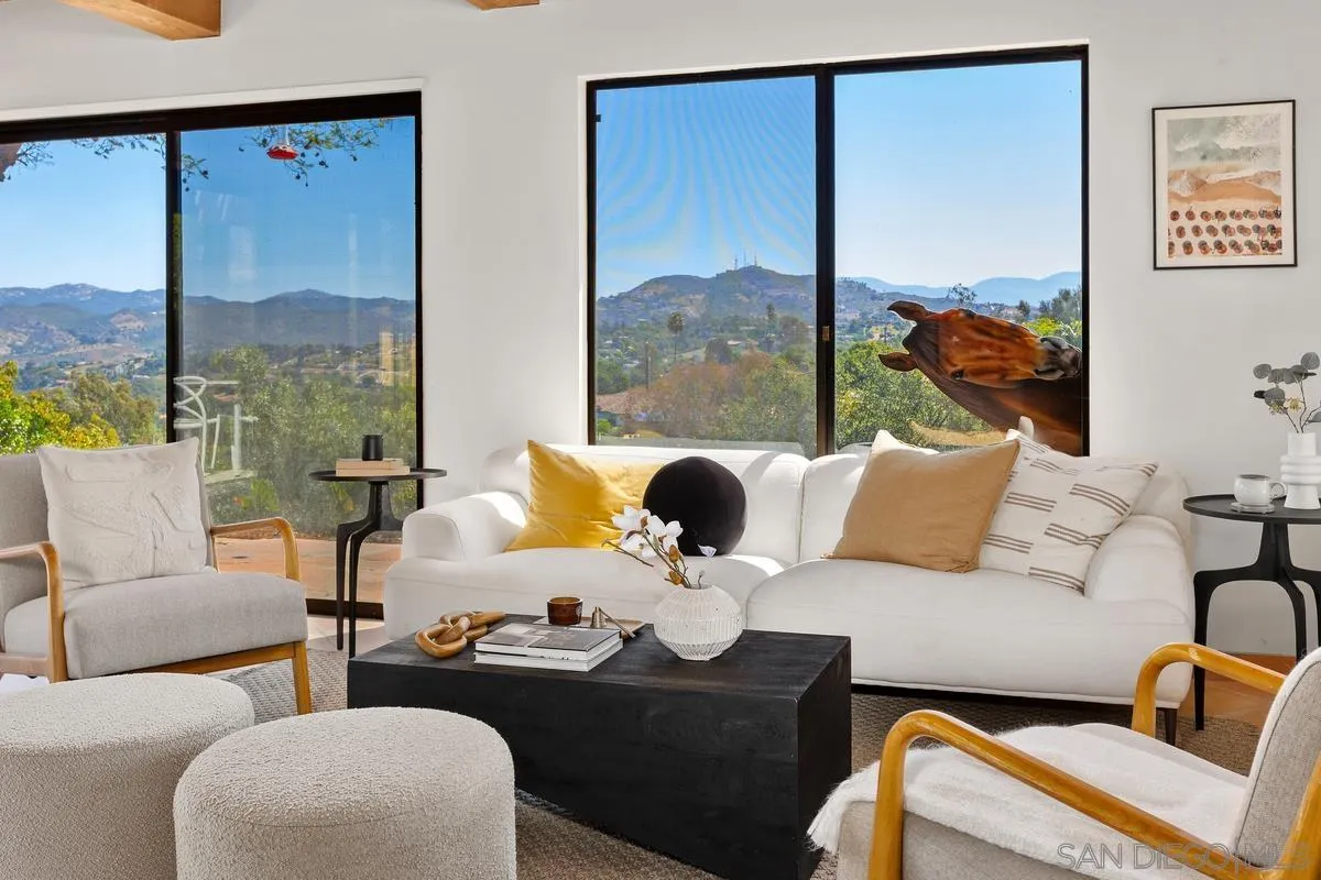 974 Via Hillview Fallbrook, CA 92028 - Photo 11 of 43 a living room with furniture and a floor to ceiling window