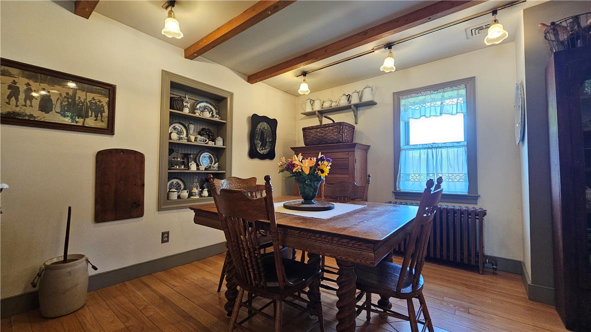 585 Buttermilk Road Hellertown, PA 18055 - Photo 8 of 82 Authentic wood flooring and rustic exposed beams define this charming dining space.
