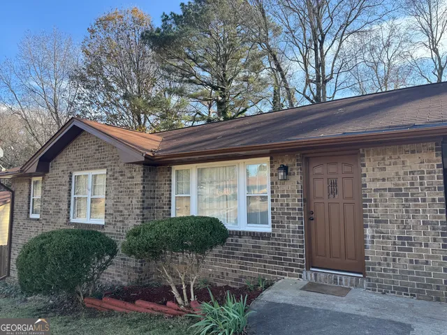 a front view of a house with garage