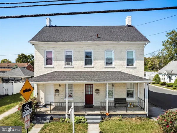 a front view of a house with a porch