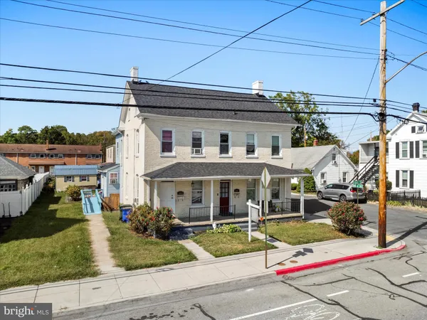 a front view of a house with porch
