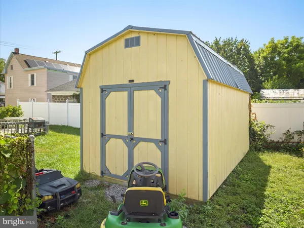 a view of a back yard with an outdoor seating