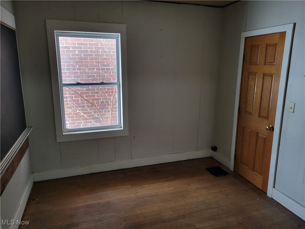 1263 West Waterloo Road Akron, OH 44314 - Photo 9 of 21 Bedroom with dark wood finished floors and baseboards