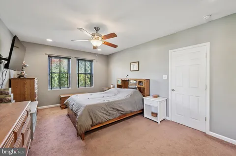 a bed room with a bed and a tv