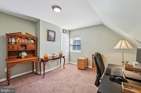 a reading room with furniture and lamp