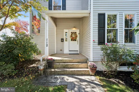 a front view of a house with stairs