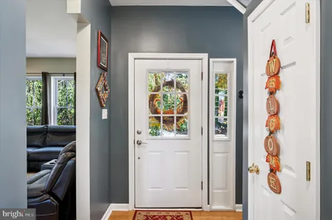 a view of an entryway with wooden floor