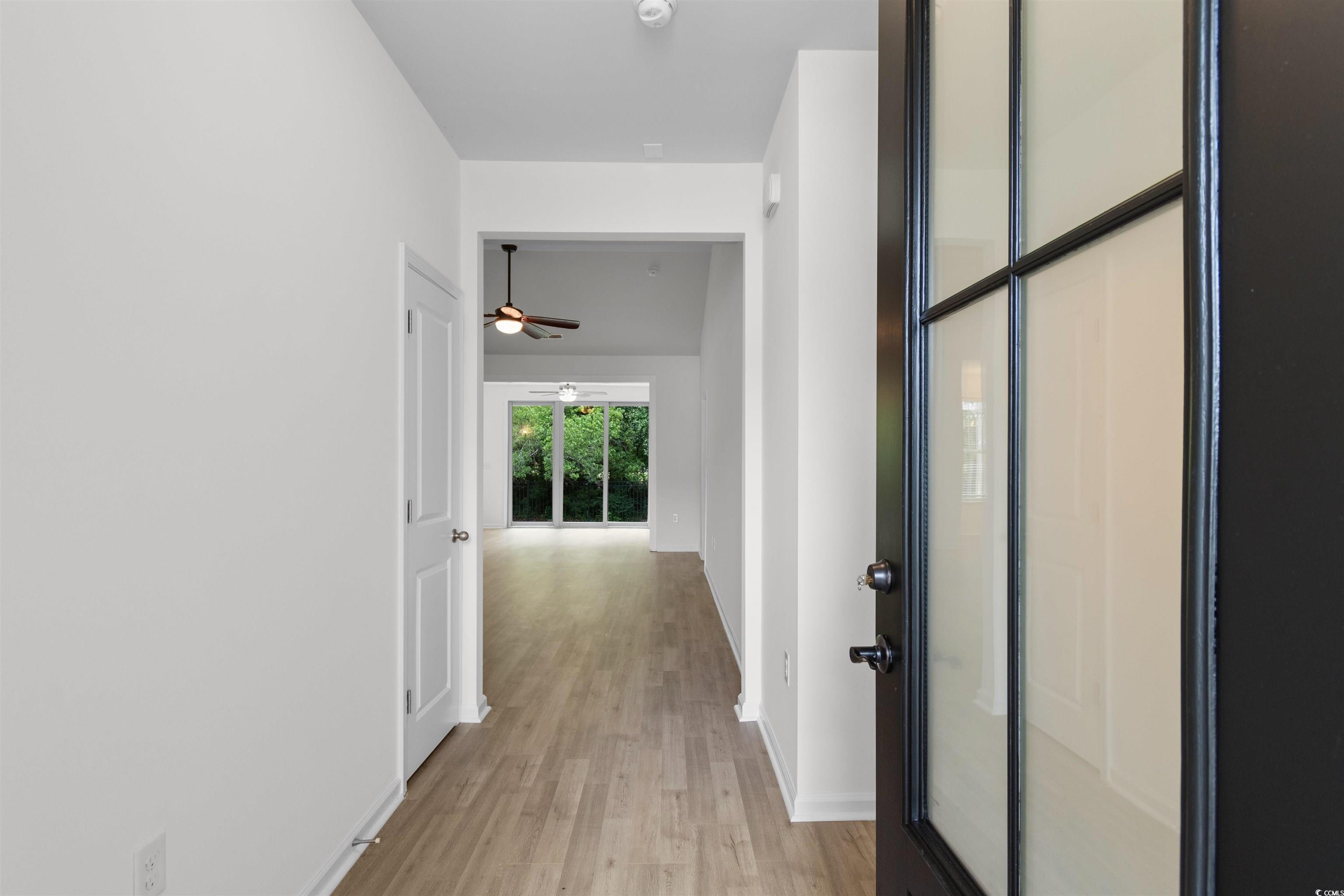 124 Shady Arbor Loop Longs, SC 29568 - Photo 2 of 40 Hallway with light wood finished floors and baseboards