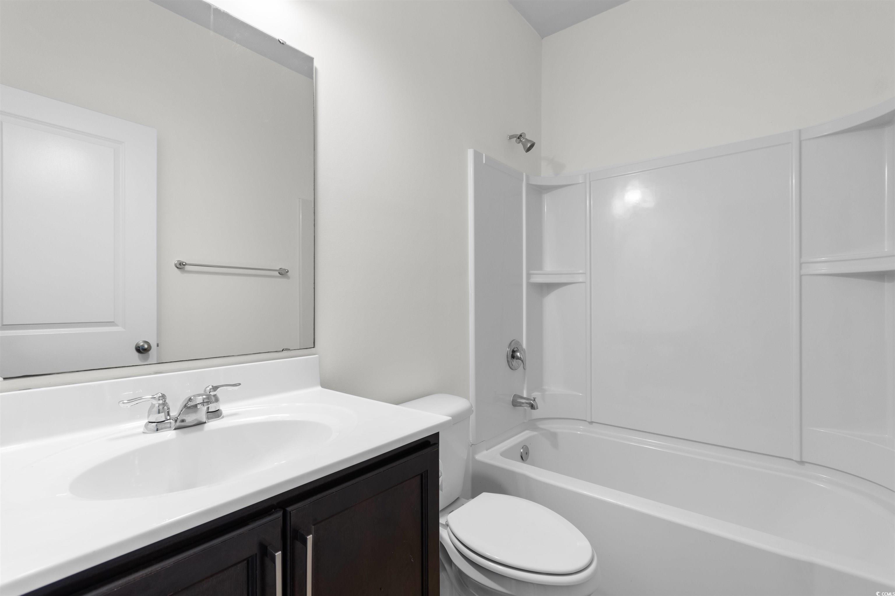 124 Shady Arbor Loop Longs, SC 29568 - Photo 22 of 40 Bathroom featuring vanity and bathtub / shower combination